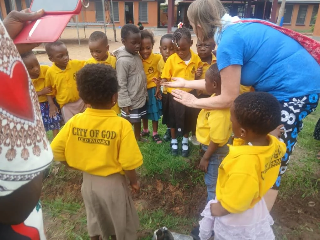 Young pupils gathered during a school outreach in 2026